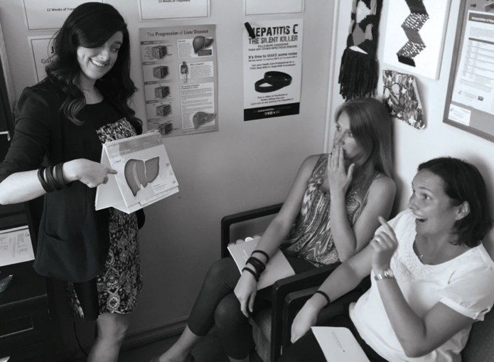 Clinic staff and patients with Deal With It screening materials.