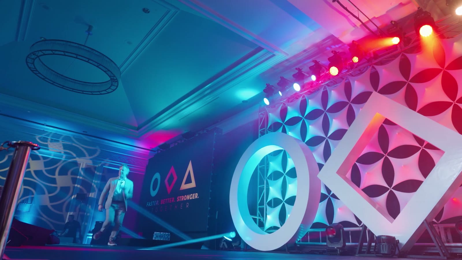 [CONFIRM] Stage lighting and set design at a live client event.