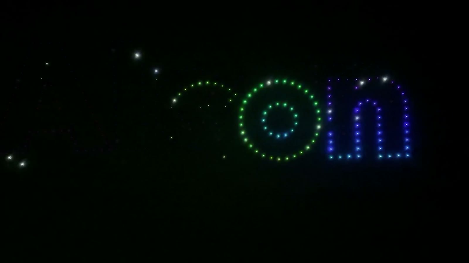 [CONFIRM] Drone light show above a night-time event.