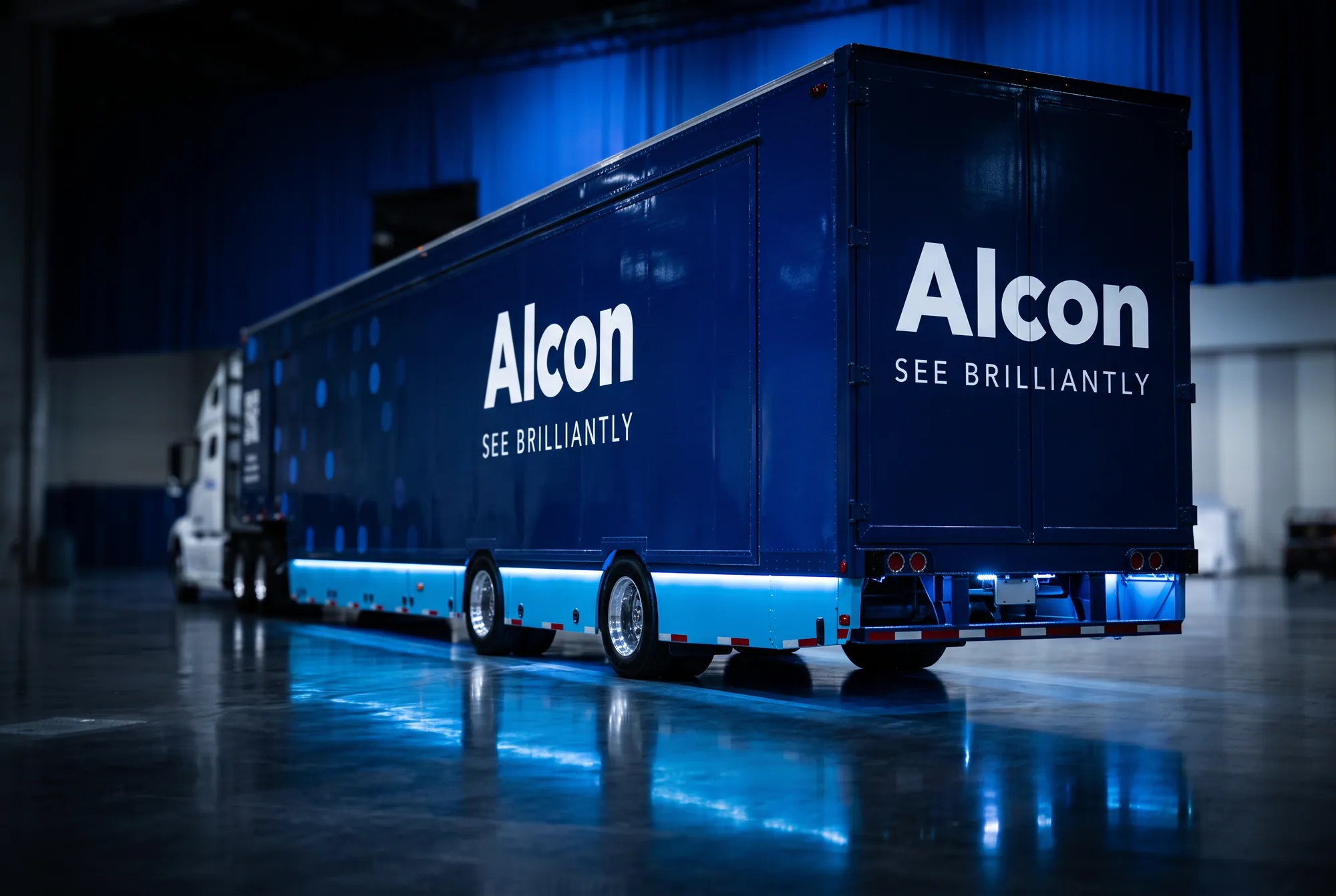 The Alcon Suite Spot trailer photographed low and close, showing the See Brilliantly wordmark and underlighting.