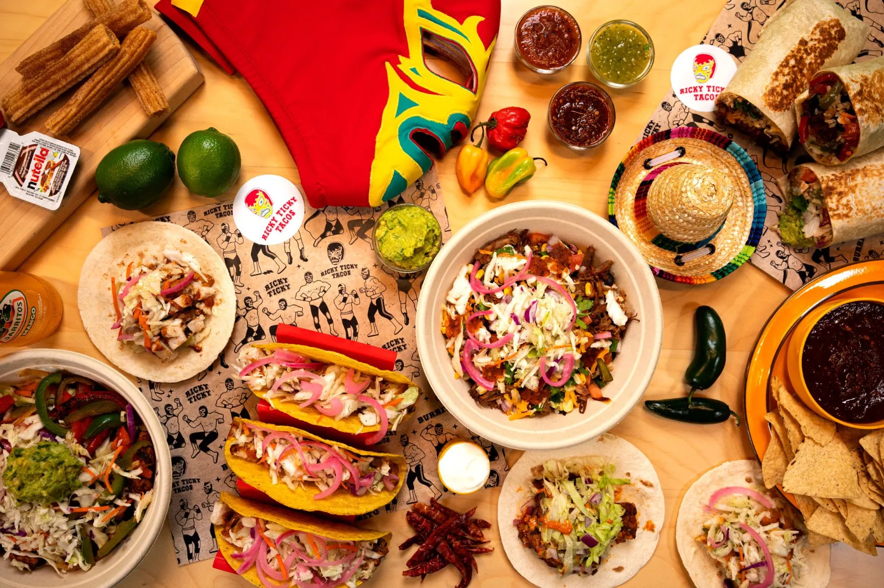 Overhead brand shot of the Ricky Ticky Tacos menu on branded wrap paper.